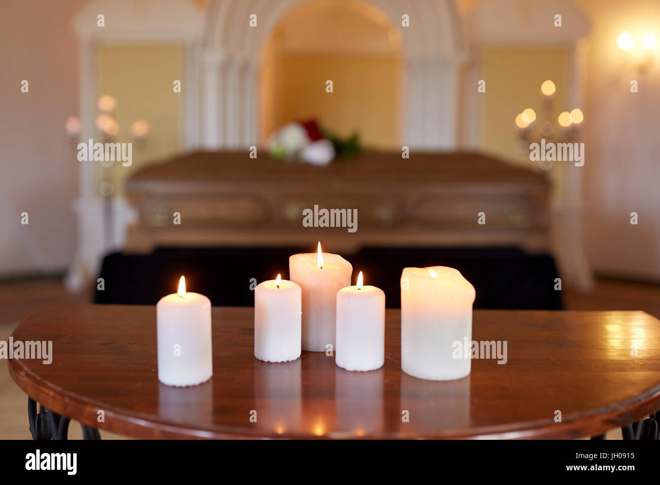 burning candles and coffin in church at funeral Stock Photo Alamy
