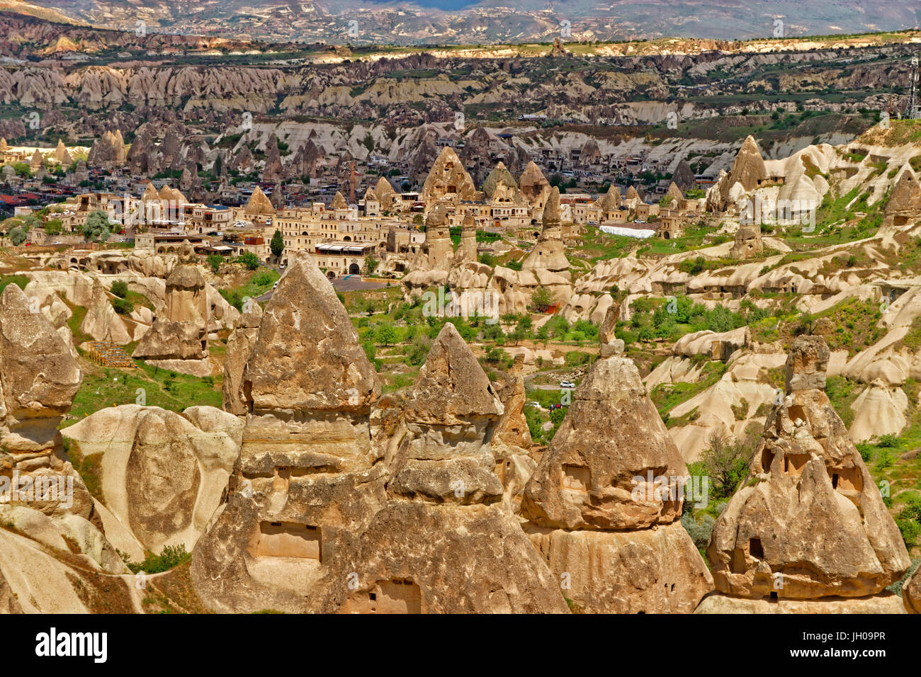 Cave dwellings and fairy chimneys at Goreme National Park, Cappadocia, Turkey Stock Photo