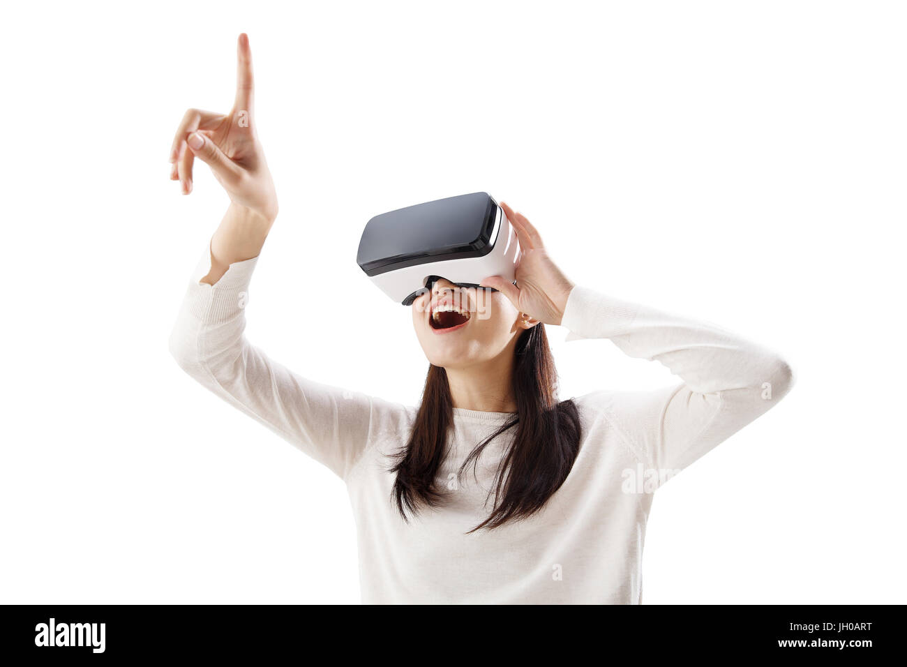 Young woman using virtual reality headset Stock Photo - Alamy