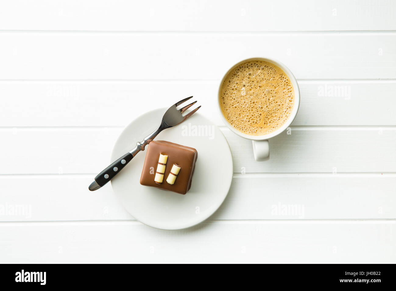 Sweet chocolate dessert  and coffee cup. Top view. Stock Photo