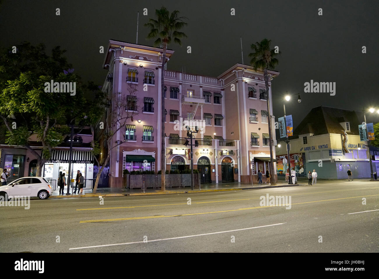 Los Angeles, California, USA Pink apartment building on Hollywood Boulevard and Hudson Avenue