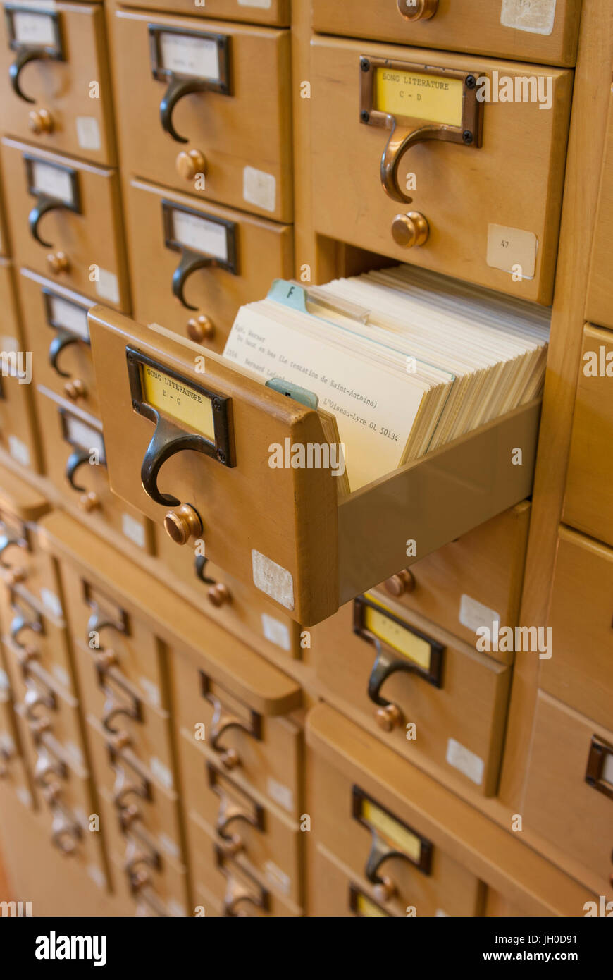 A Wooden Drawer Card Catalog In A Library Using The Dewey Decimal