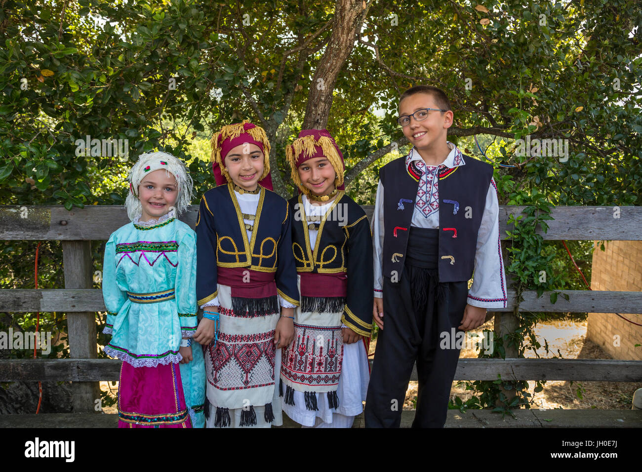 4, four, Greek-Americans, 3 girls, 1 boy, Greek folk dancers, traditional costume, Marin Greek Festival, city of Novato, Marin County, California Stock Photo