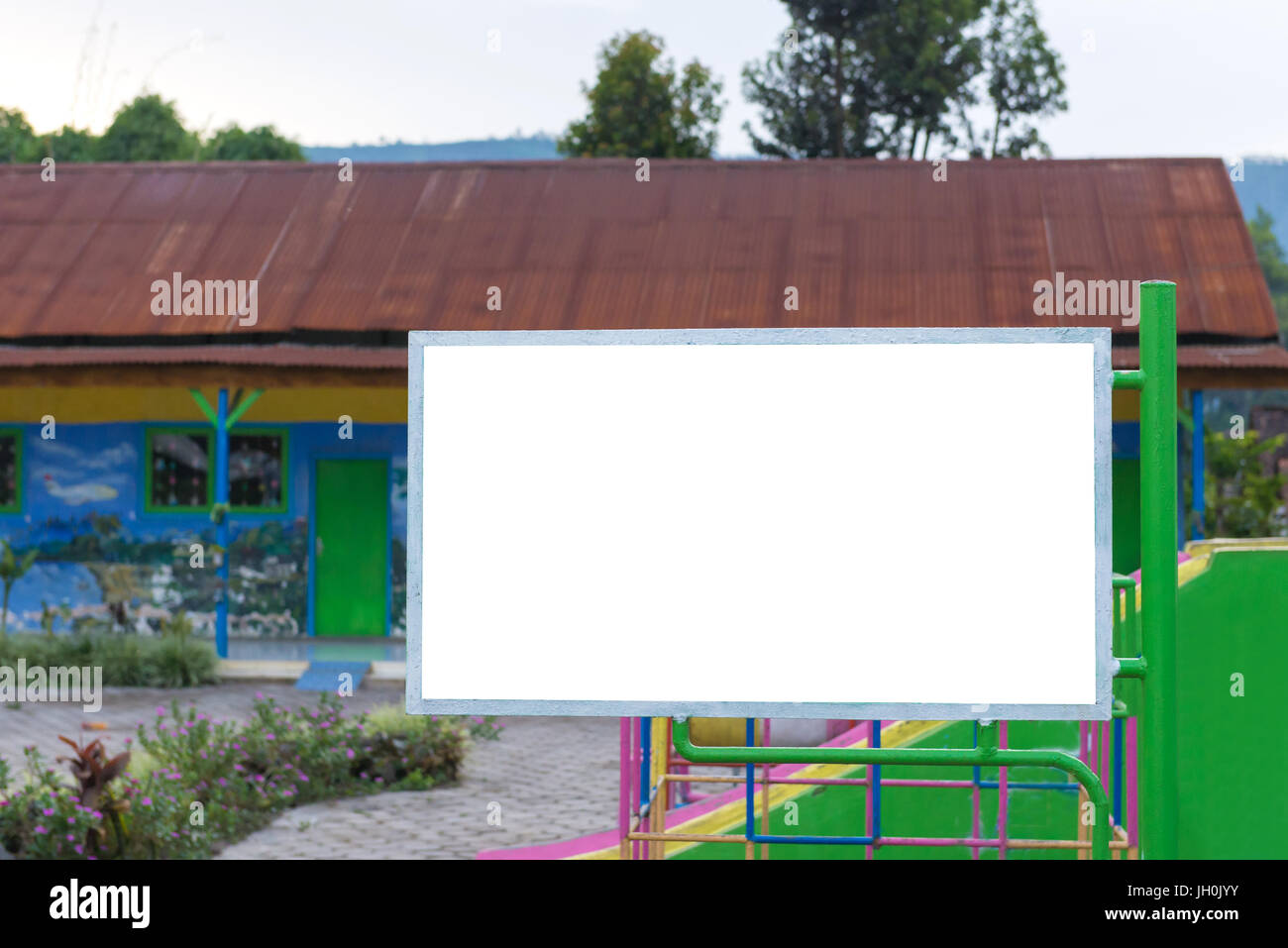 blank billboard in green park field at city park zone Stock Photo - Alamy