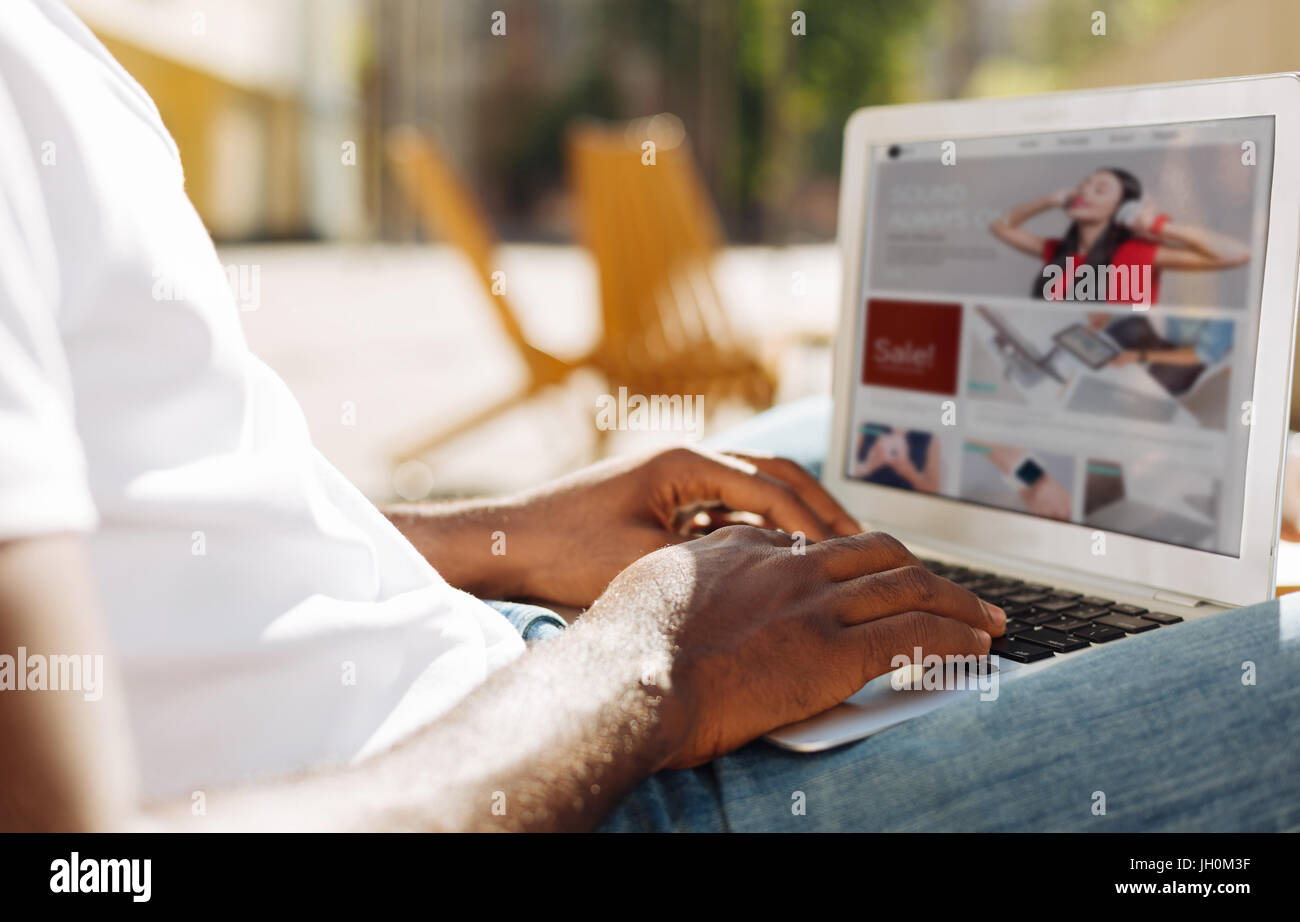 Determined motivated man searching for something online Stock Photo