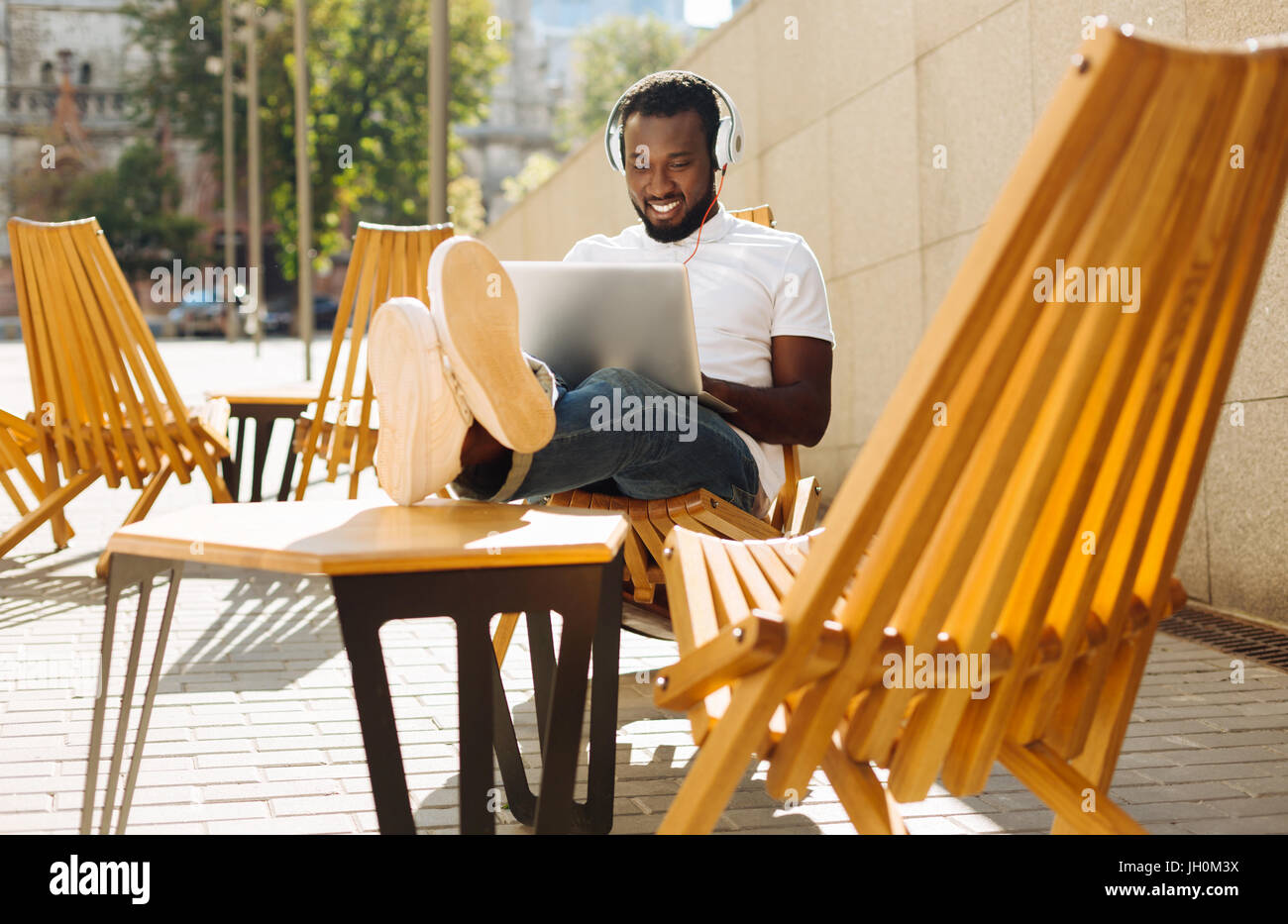 Charming clever man enjoying his day Stock Photo