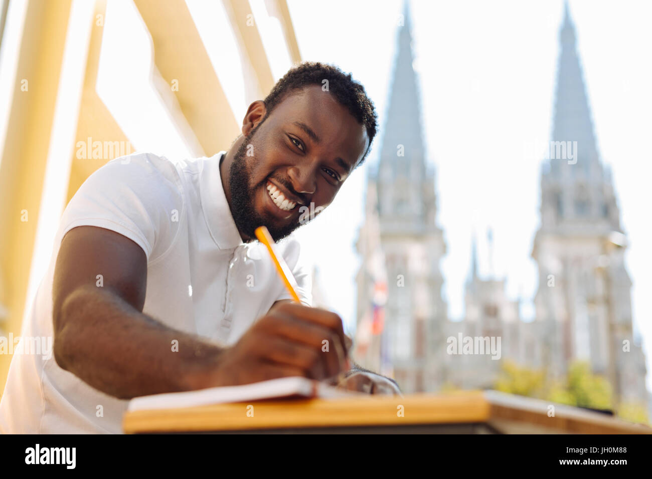 Dedicated hardworking man applying positive approach Stock Photo