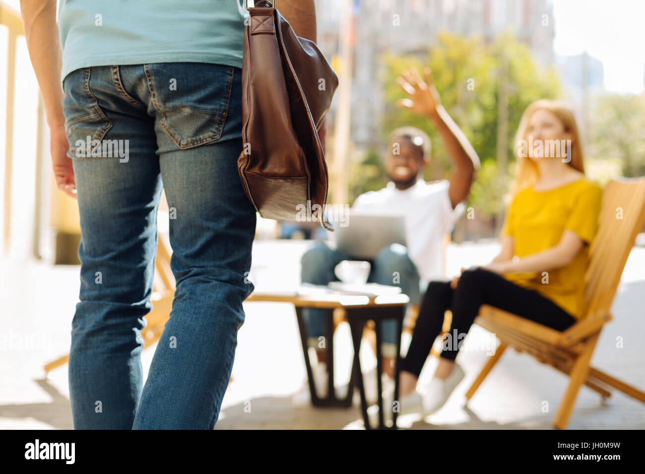 Nice enthusiastic man joining his squad Stock Photo