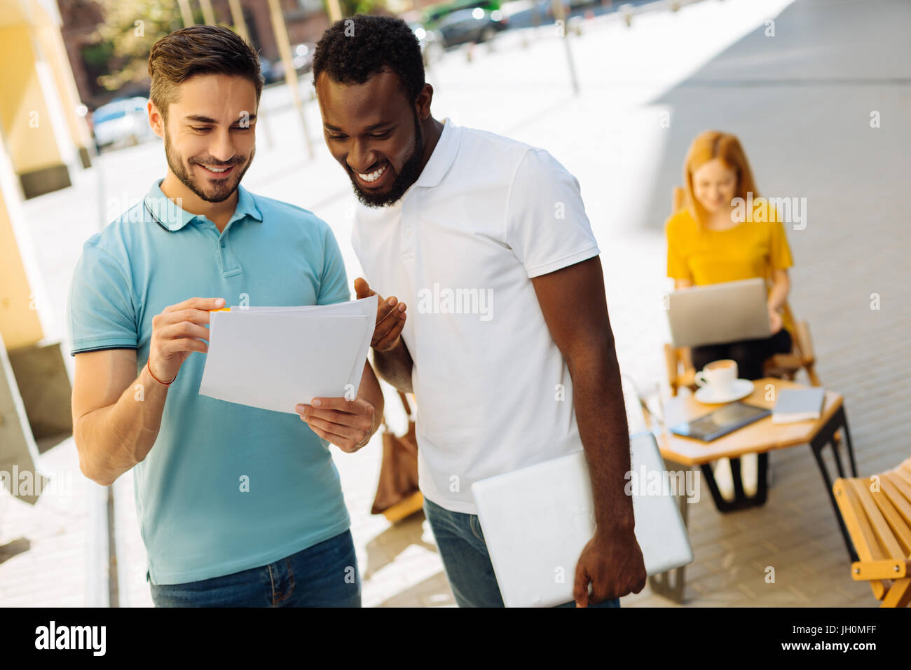 Optimistic talented man asking a friend for his opinion Stock Photo - Alamy