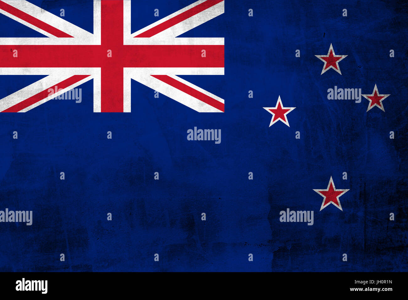 Grunge New Zealand Flag on the concrete wall Stock Photo