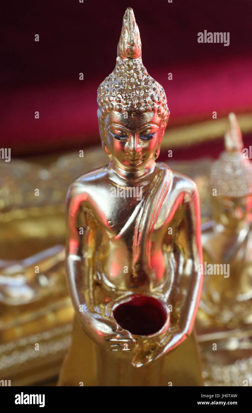 Wat Velouvanaram.  Golden Buddha statue.  France. Stock Photo