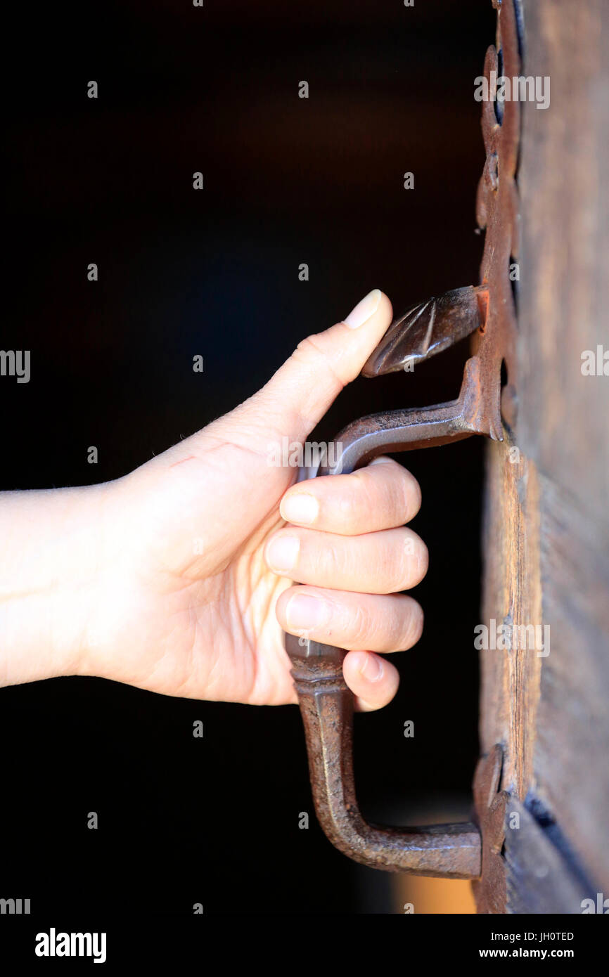 Champel chapel.  Old door with hand.  France. Stock Photo