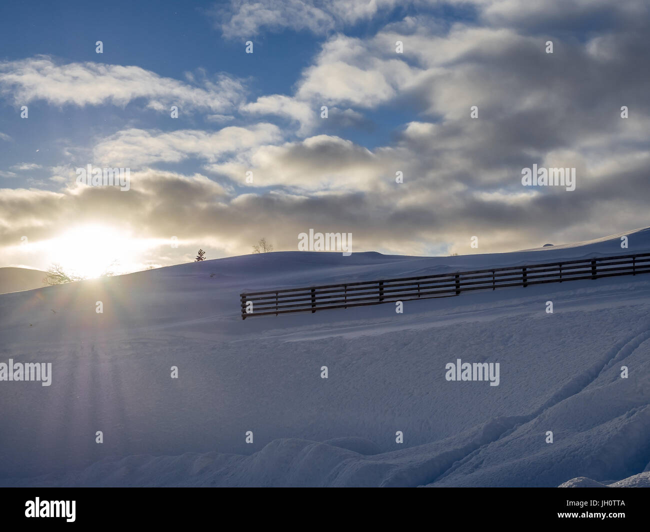Fence and a sunset Stock Photo - Alamy