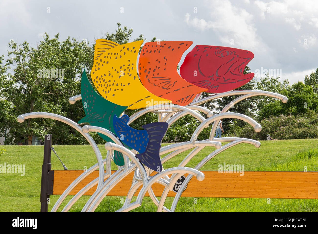 Sculpture of a Rainbow Trout by Calgary artits Jeff de Boer, entrance of Enmax Park, Calgary, Alberta, Canada Stock Photo