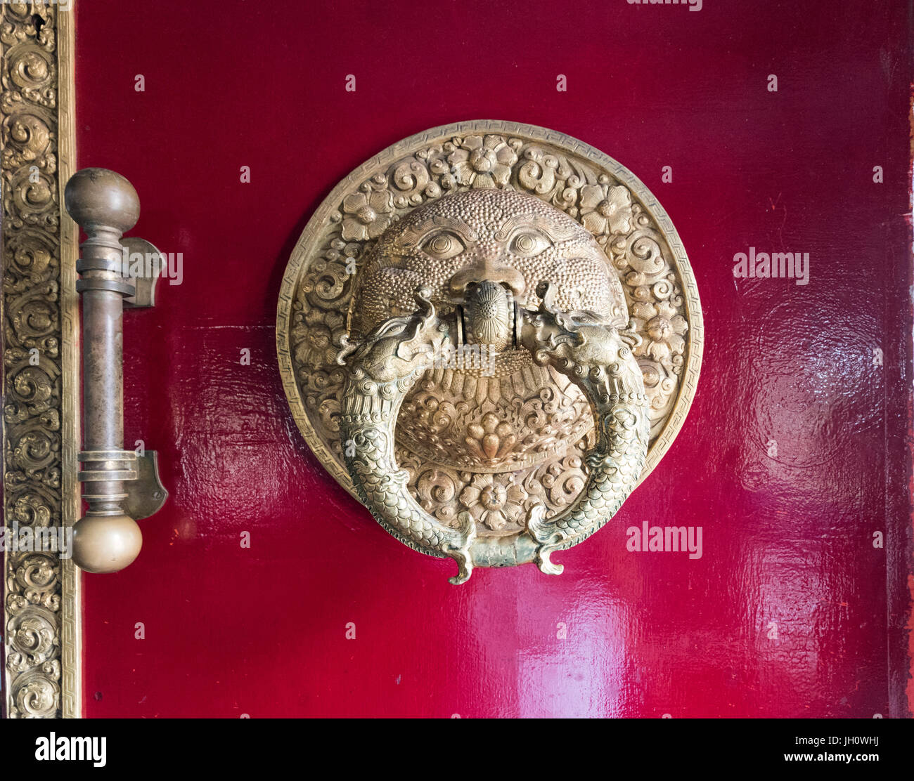 Metal door knocker in golden temple Namdroling Monastery Tibetan Monastery at Coorg Karnataka India Stock Photo