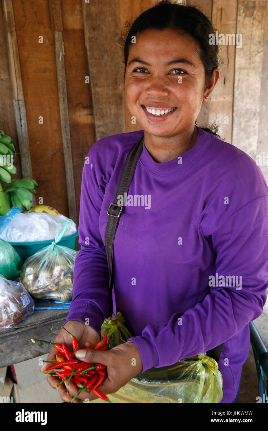 Microfinance client holding chilies. Cambodia. Stock Photo