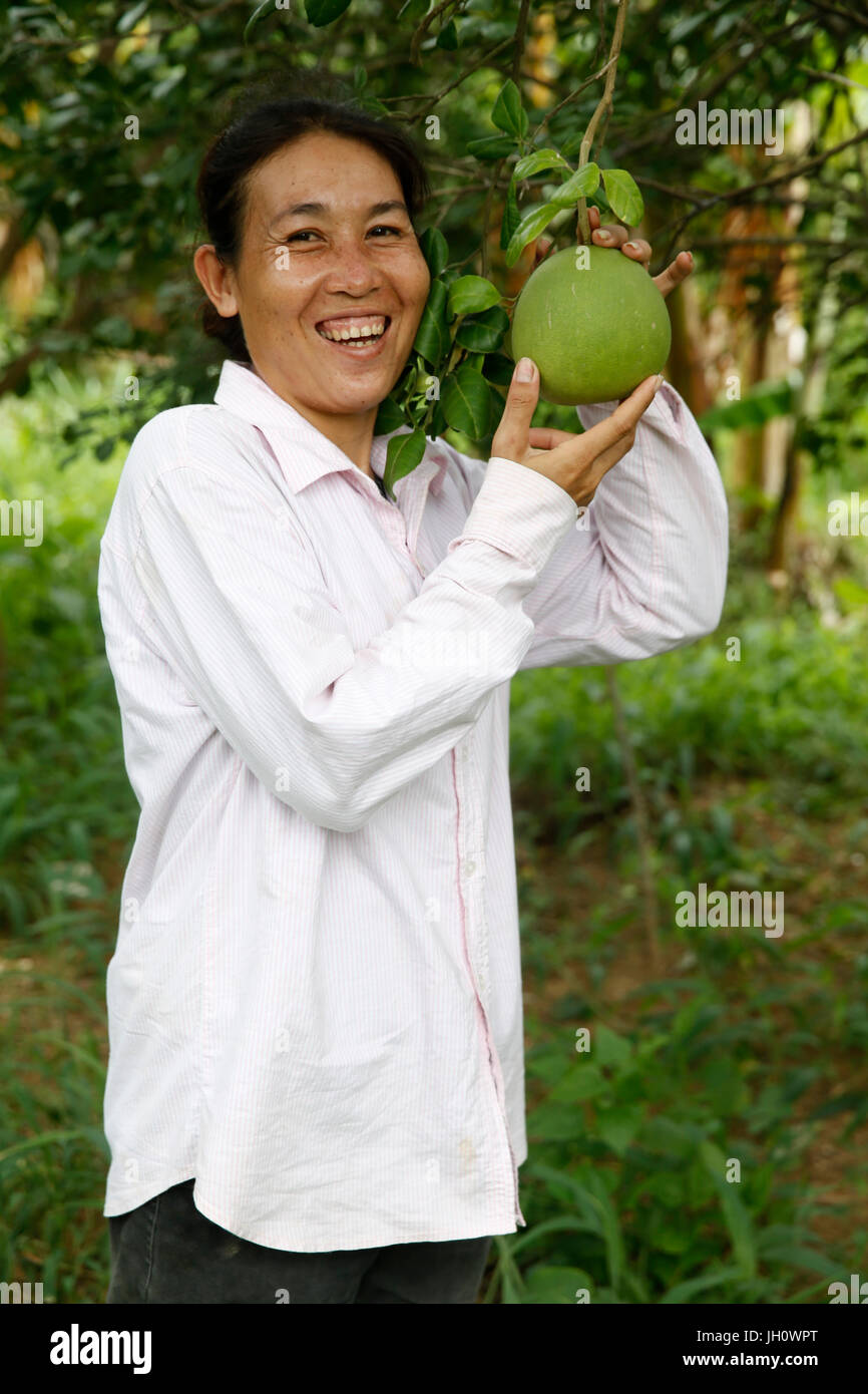 Tong Samphots received $500 from AMK microfinance client for her farm.  Cambodia. Stock Photo