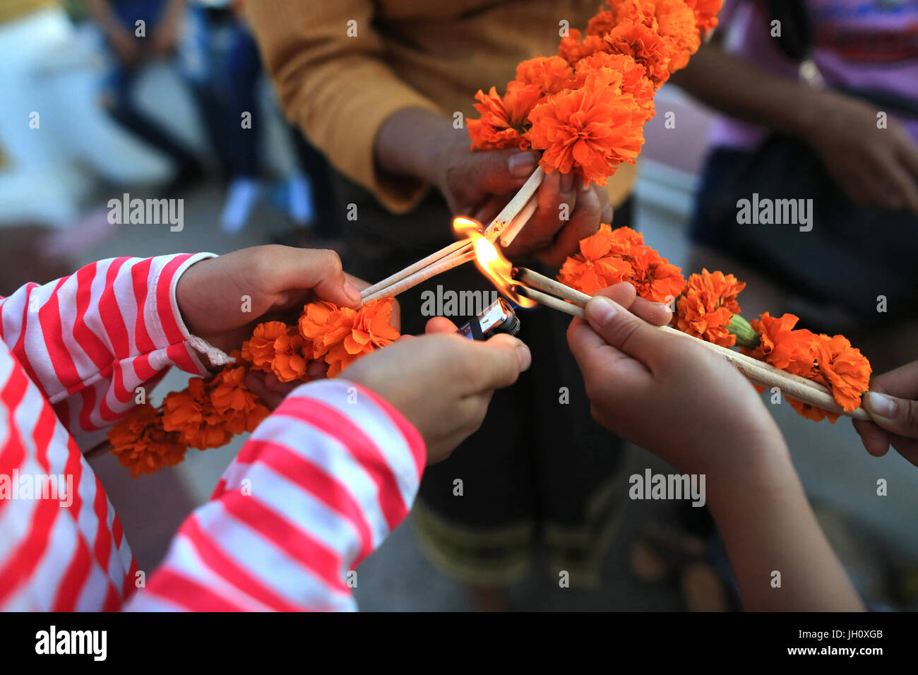 Lighting incense sticks. Laos Stock Photo Alamy