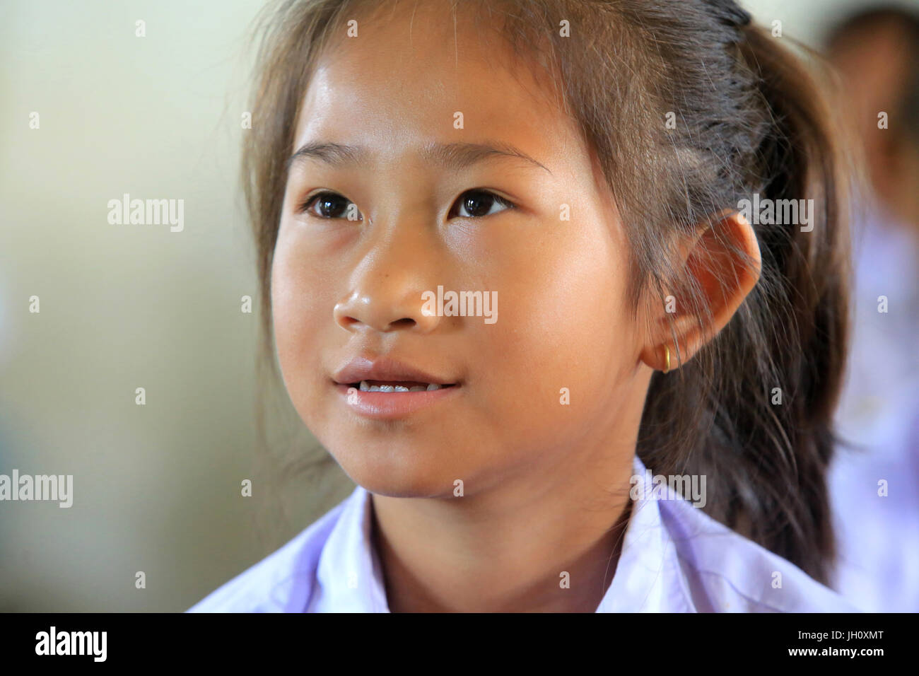 Laotian schoolgirl. Portrait. Elementary school.   Laos. Stock Photo