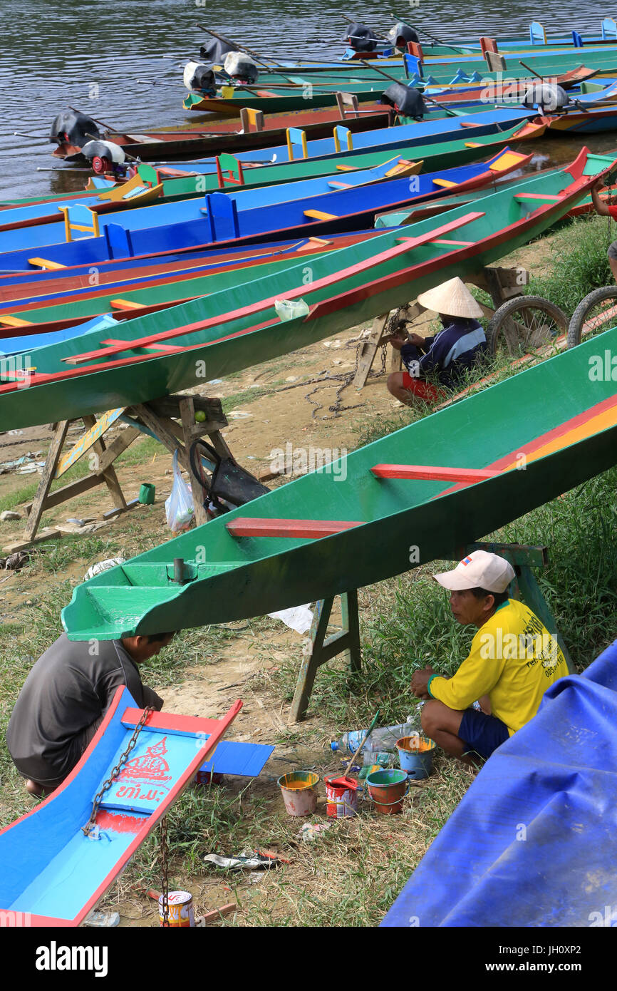 Laos painting a boat. Vieng Vang. Laos. Stock Photo