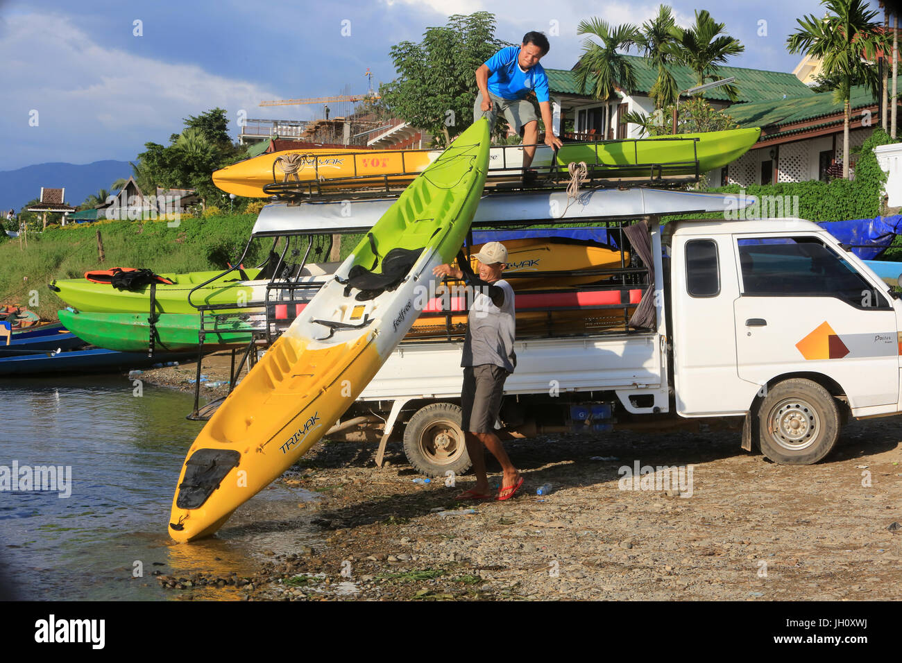 Canoe loads on a van.  Laos. Stock Photo