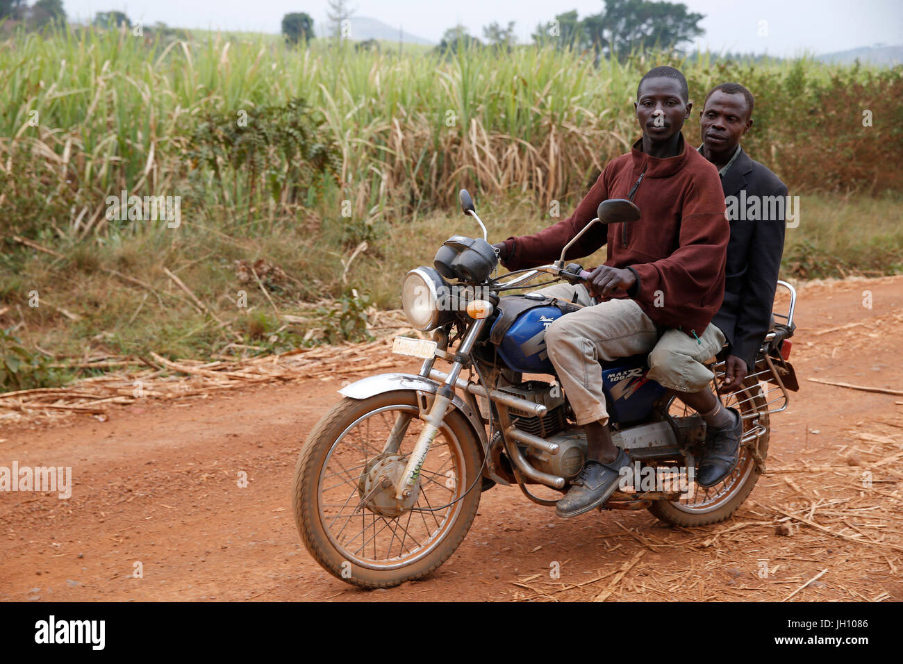 Ugandan men on a motorcycle. Uganda. Stock Photo