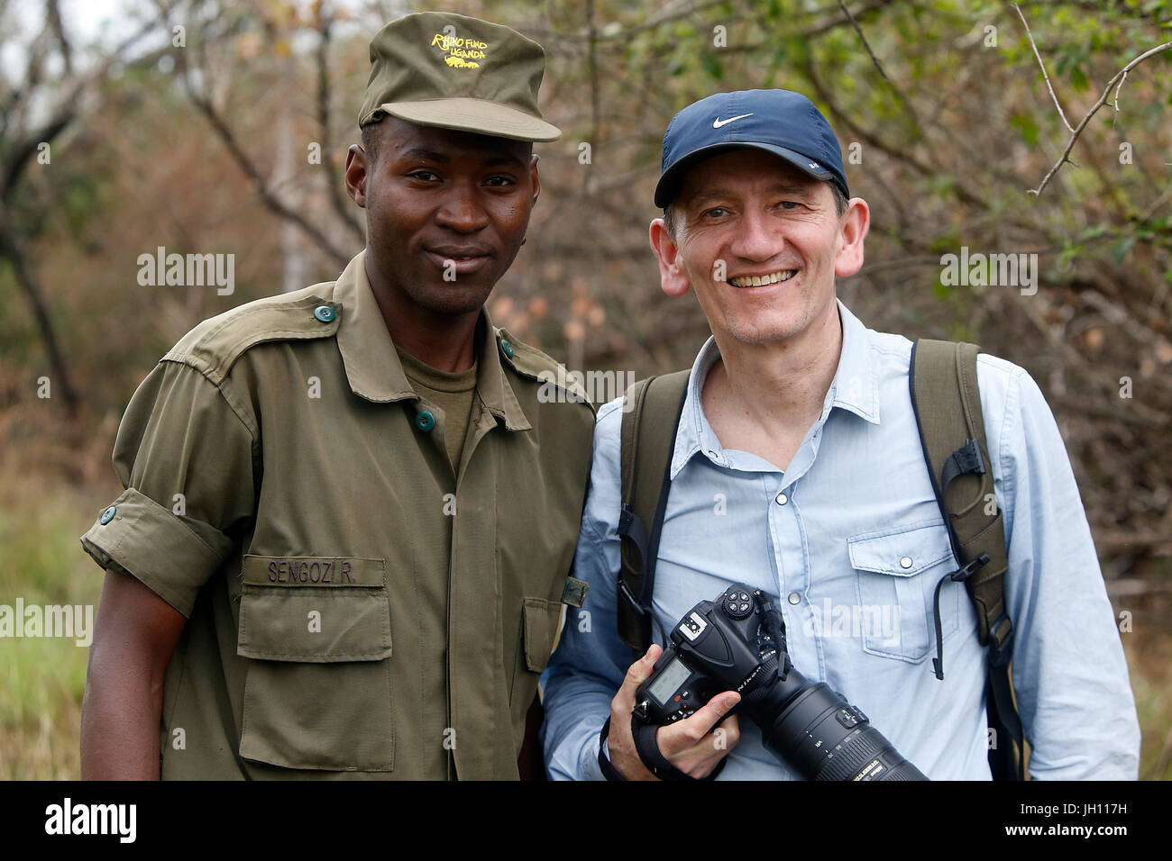Ranger and tourist in Ziwa national park. Uganda. Stock Photo
