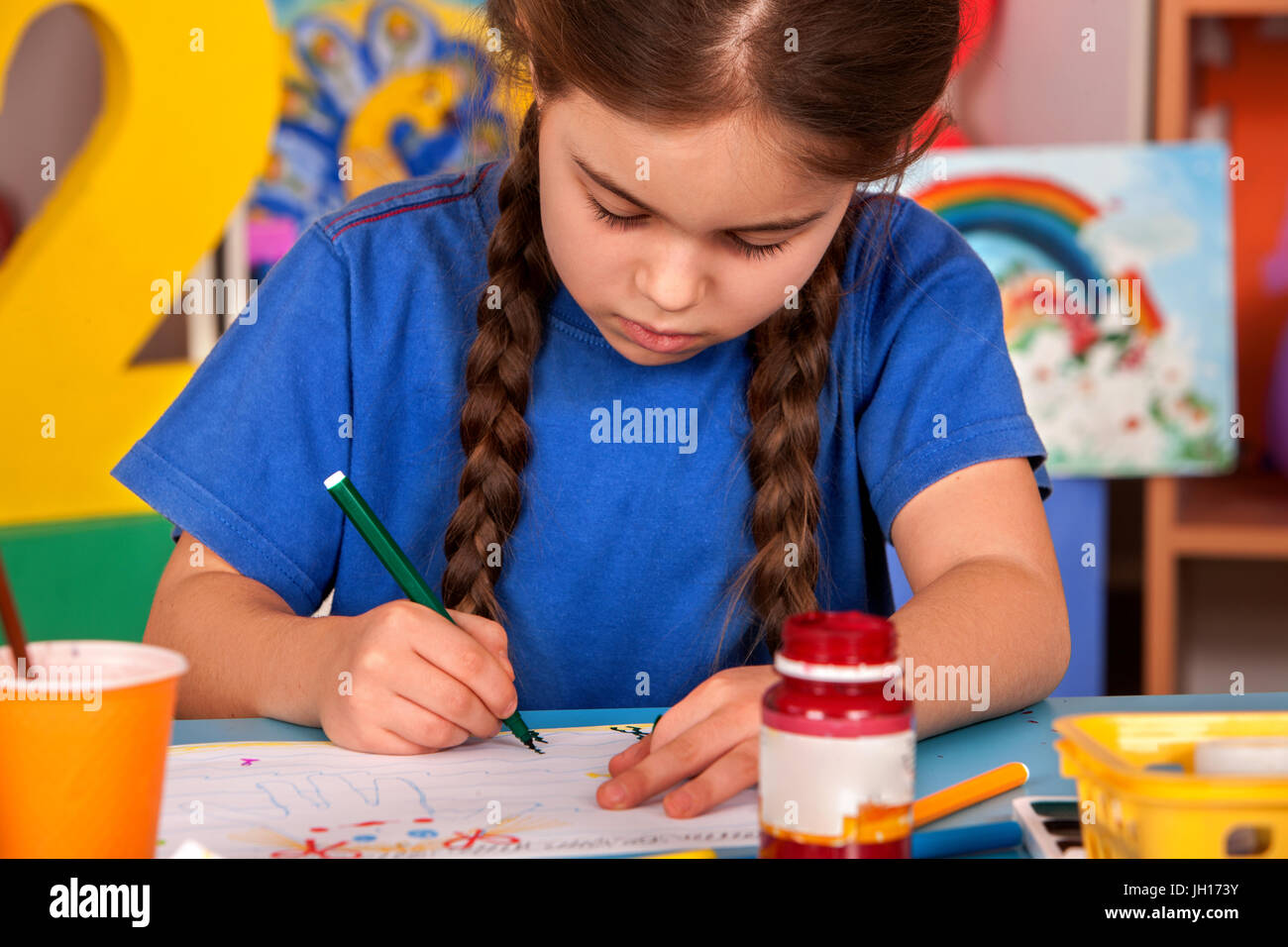 Small students girl painting in art school class Stock Photo - Alamy