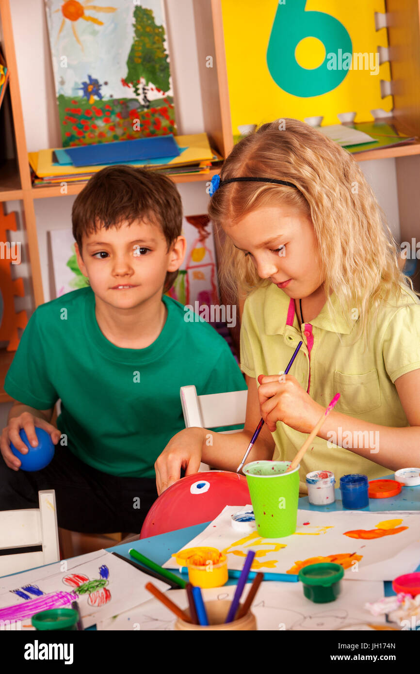 Small students girl and boy painting in art school class Stock Photo ...