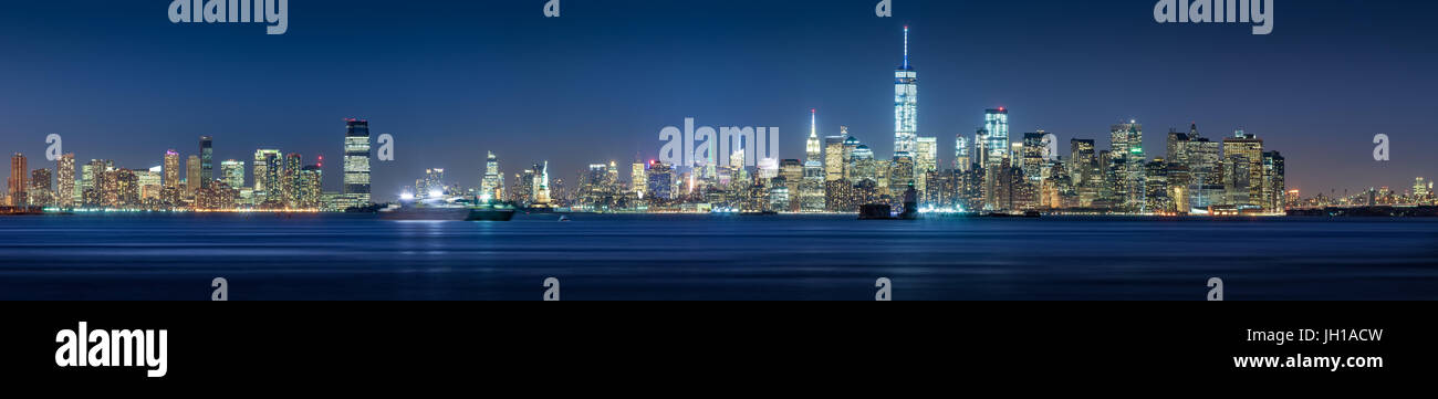 New York City Financial District skyscrapers and Hudson River at dusk. Panoramic view of Lower Manhattan Stock Photo