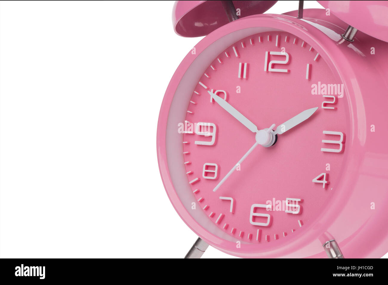 Pink alarm clock with the hands at 10 and 2 am or pm isolated on a