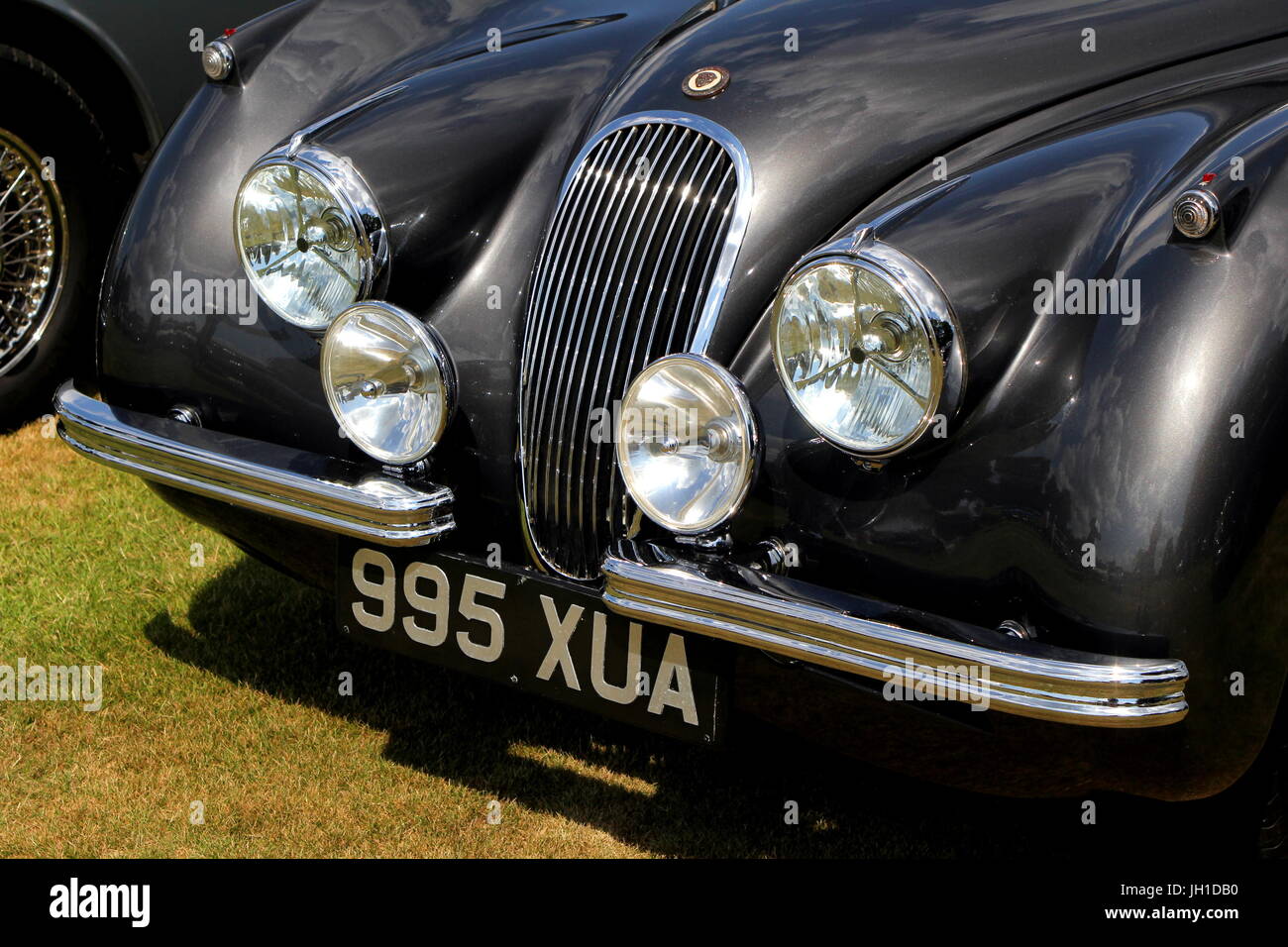 Closeup of the grille, lights and front bumper of a Jaguar XK 120 1952 Stock Photo