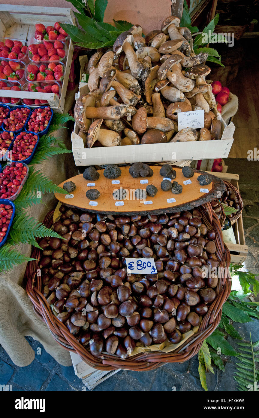 Chestnuts, truffles, cep mushrooms and strawberries for sale in Nemi village, Lazio, Italy Stock Photo