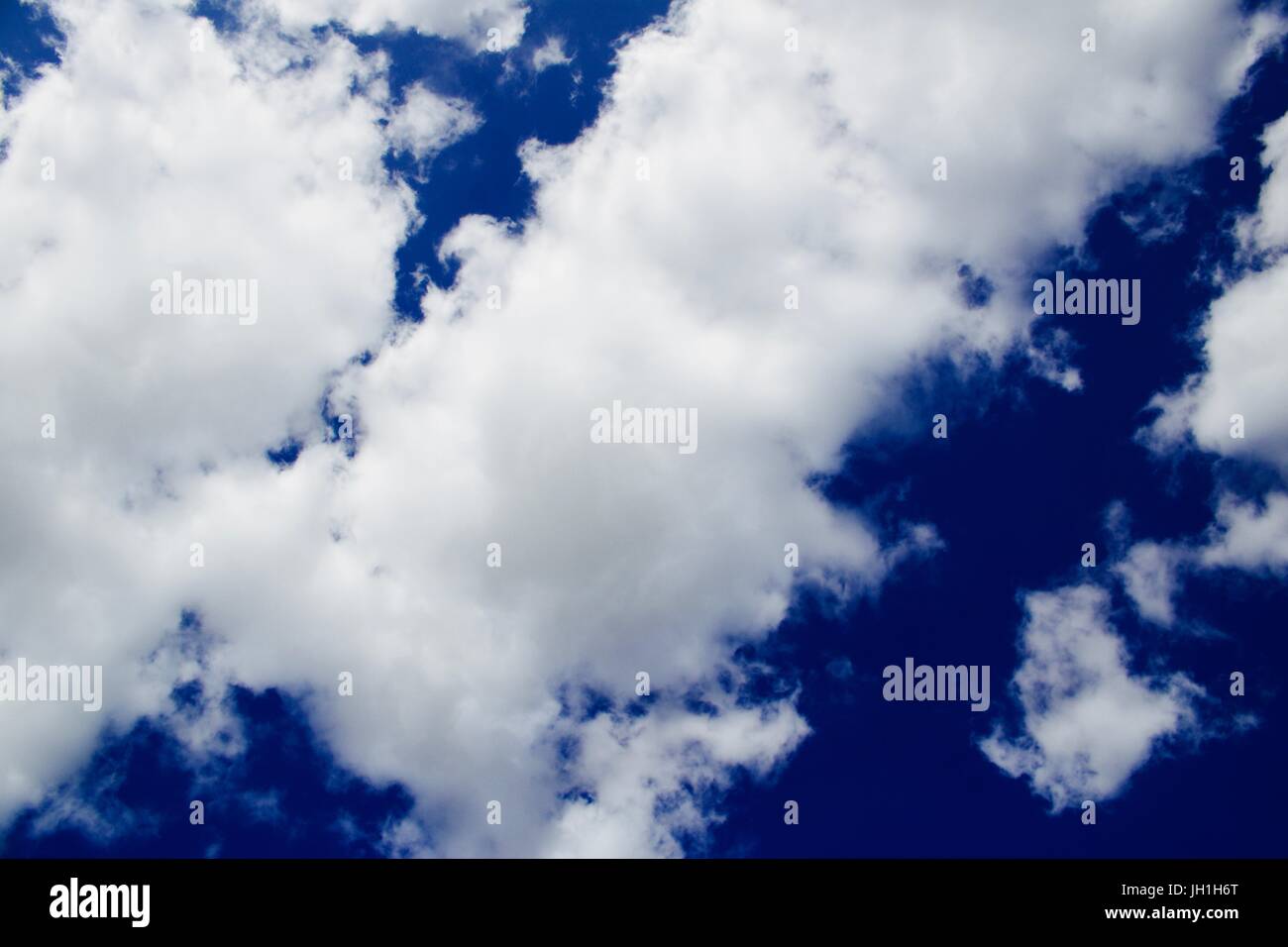 Blue sky with a white clouds. Sunny day outdoor concept Stock Photo - Alamy