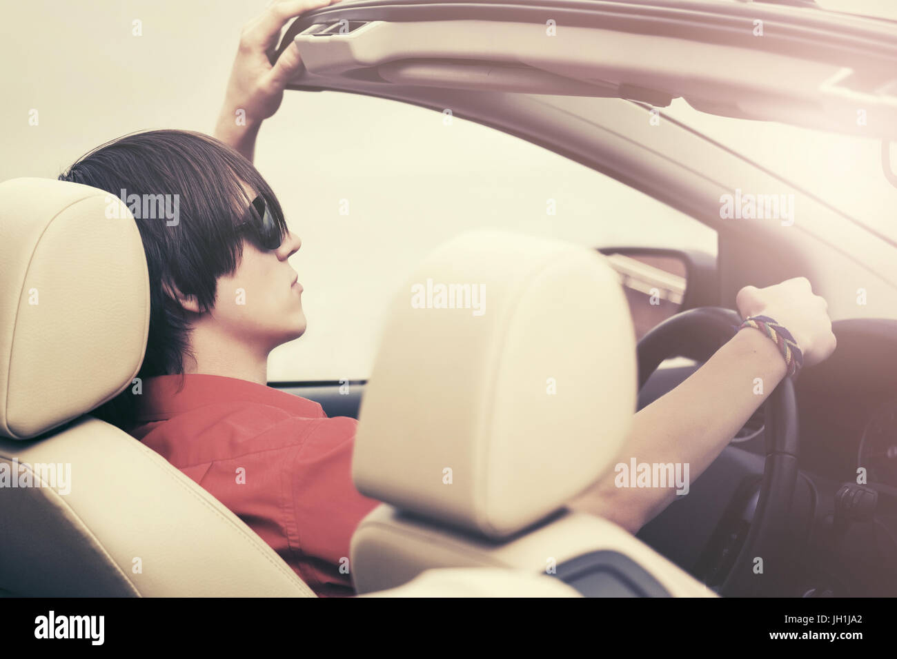 young-man-in-sunglasses-driving-convertible-car-stock-photo-alamy