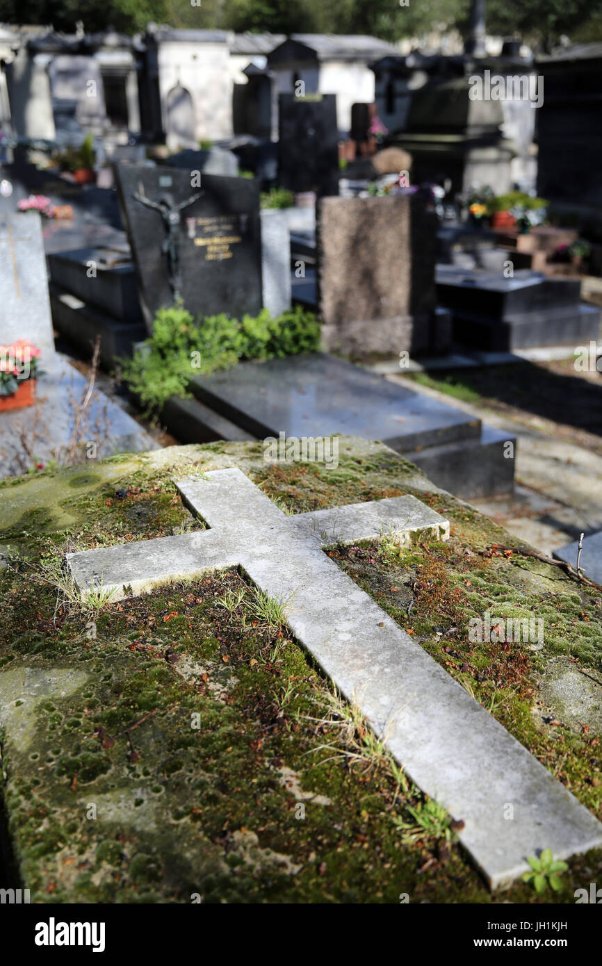 Pere Lachaise cemetery. Stone cross. Stock Photo