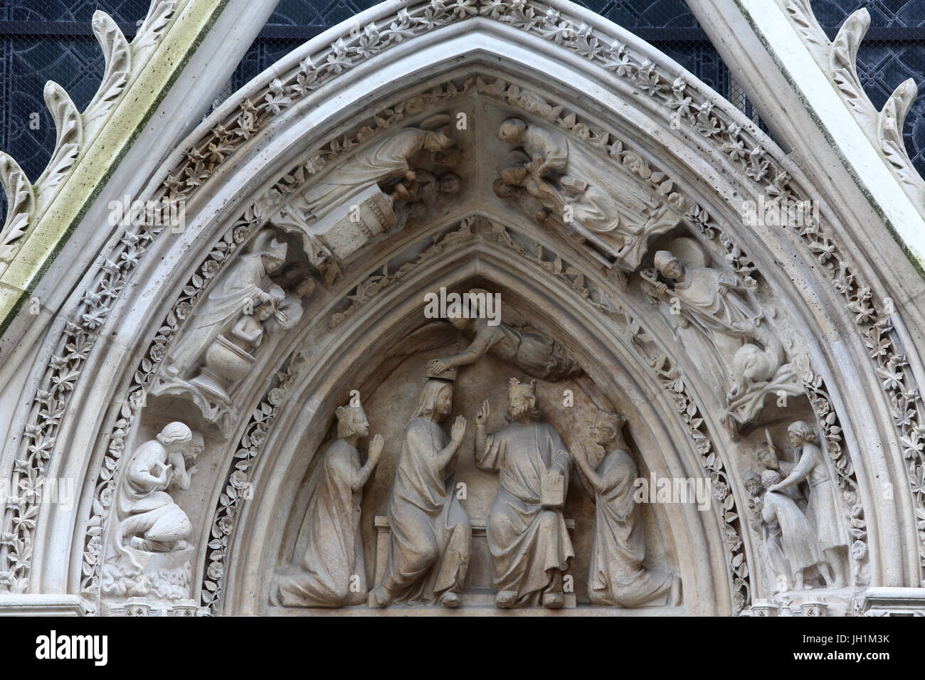 Notre Dame de Paris cathedral. Red door tympanum (c.1260).  France. Stock Photo