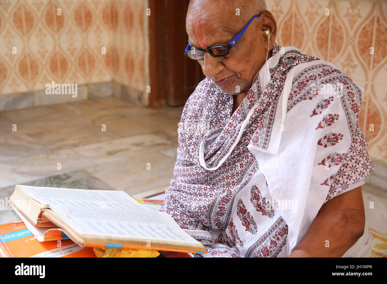 Hindu reading scriptures in Nandgaon, Uttar Pradesh. India. Stock Photo