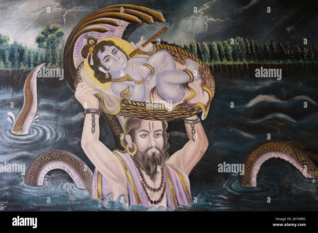 Painting in Gokul : Krishna as a baby carried over the Yamuna River by Vasudeva. India. Stock Photo