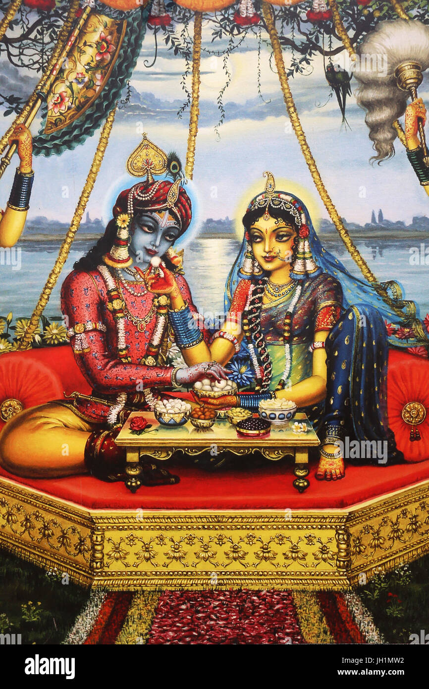 Painting depicting Hindu god Krishna sitting with his consort ...