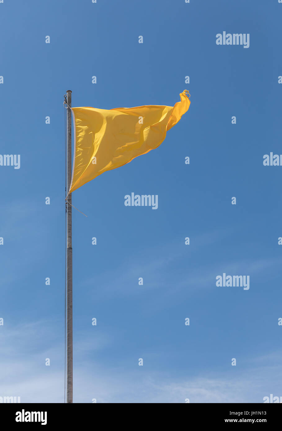 Yellow flag on the French coast for bathing dangerous Stock Photo