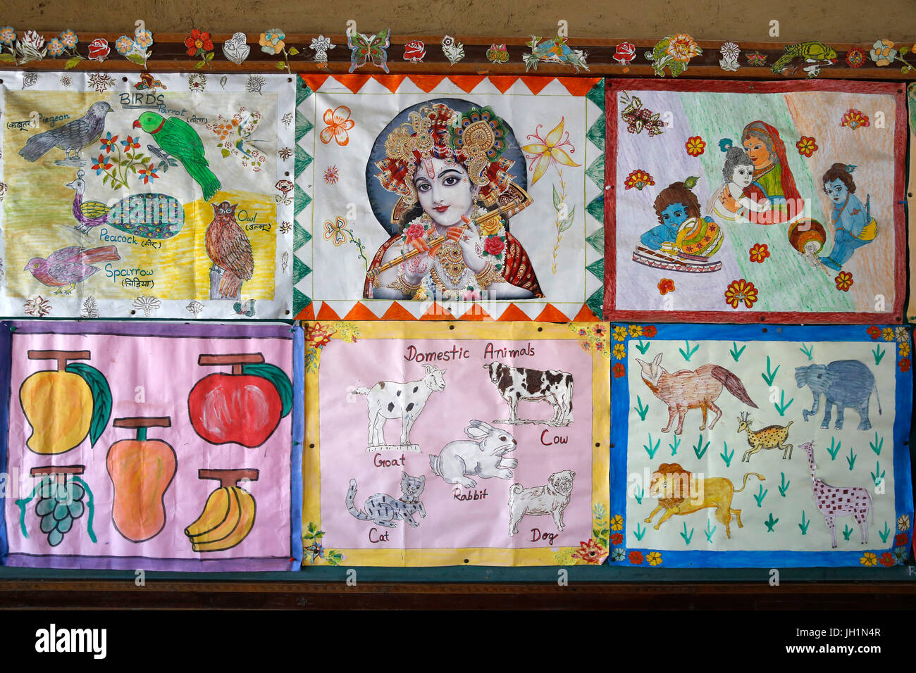 Sandipani Muni School for needy girls run by Food for Life Vrindavan. Pupil's drawing exhibited in classroom. India. Stock Photo