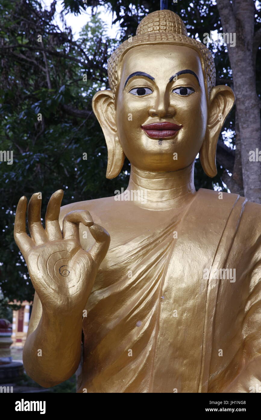 Statue depicting Buddha making a mudra. Cambodia. Stock Photo