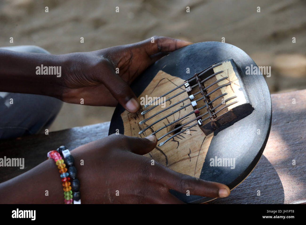 African man playing music. Close-up.  Togo. Stock Photo