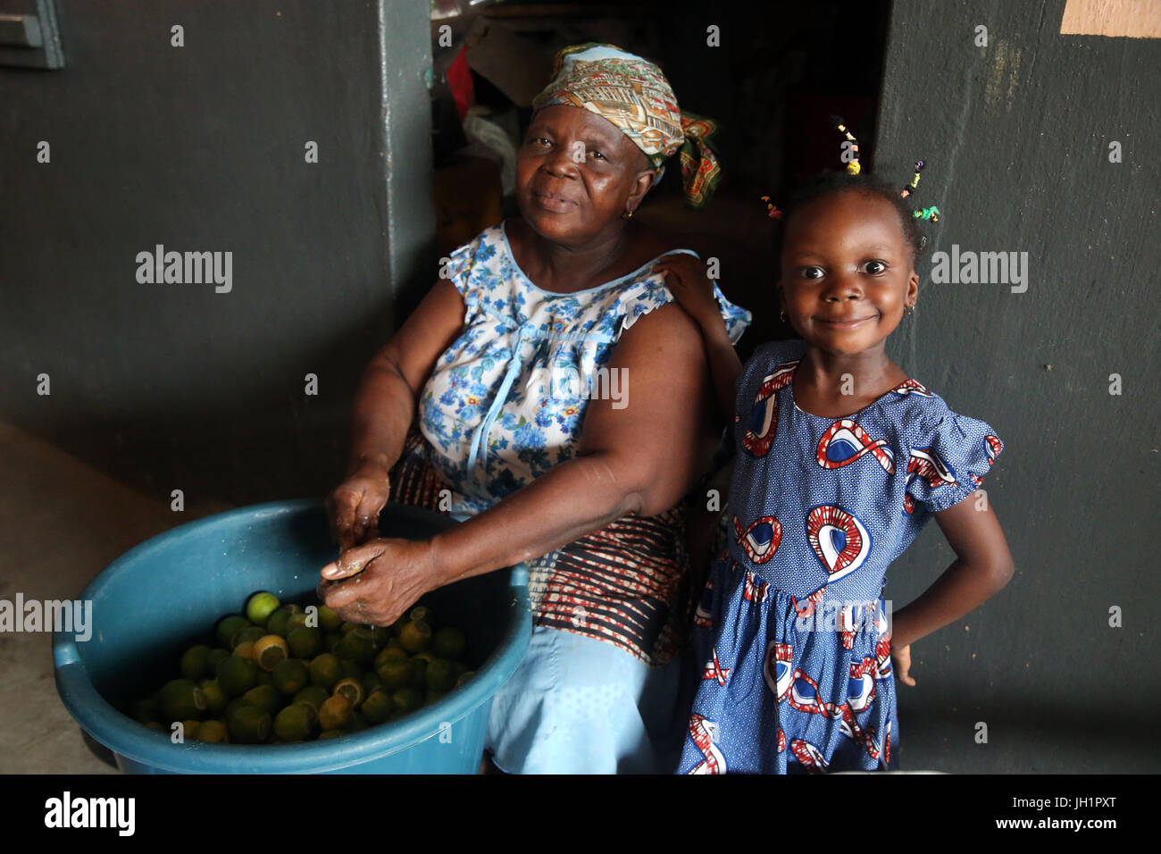 Smiling young girl with her grandmother.  Lome. Togo. Stock Photo