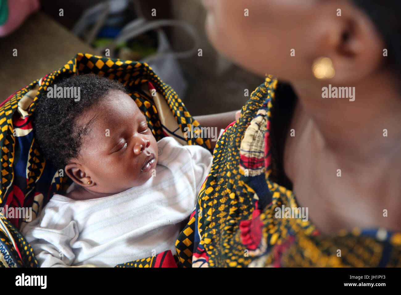 African village life. Woman with her baby.  Lome. Togo. Stock Photo