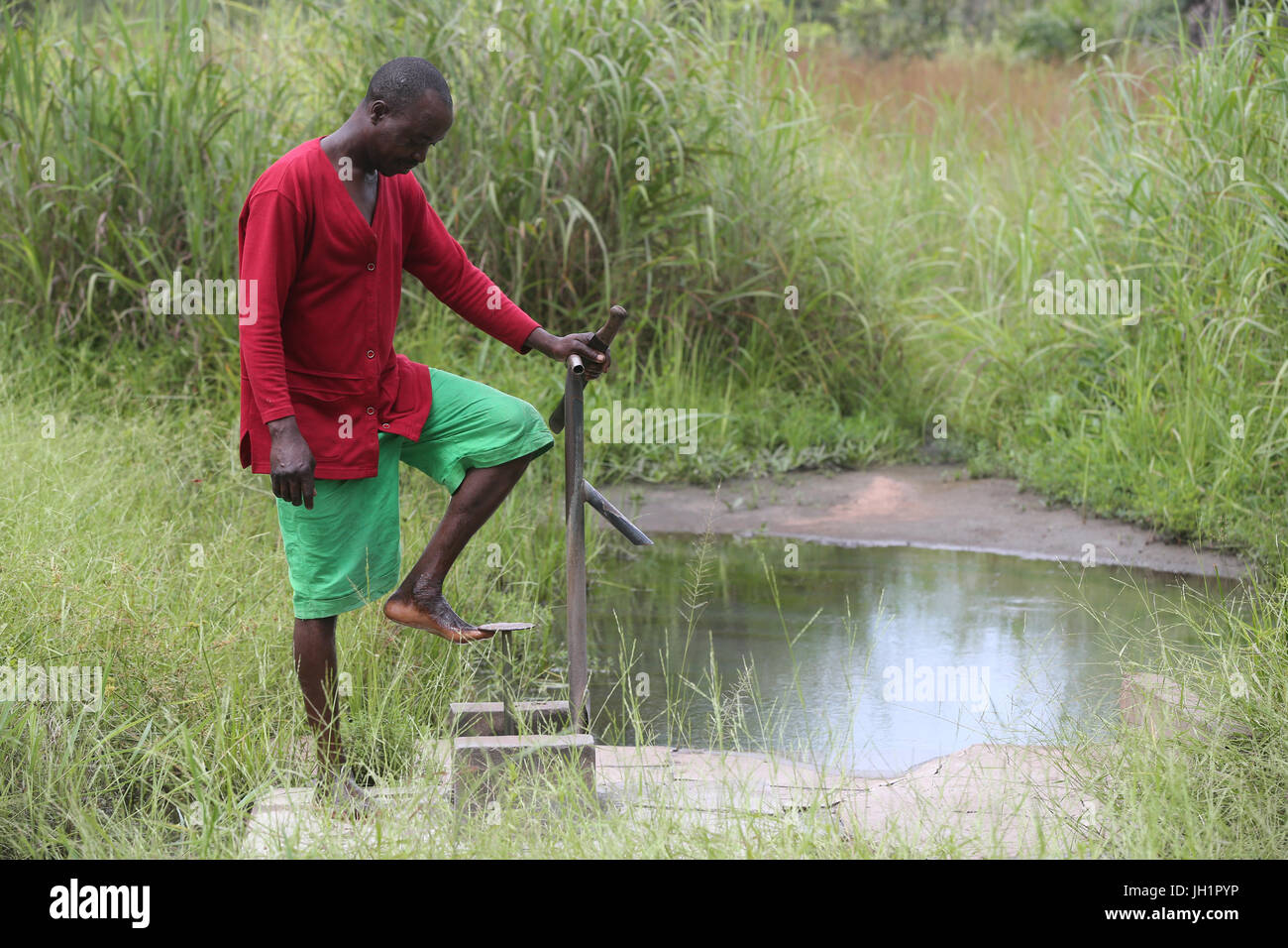 African village life manual water pump. Togo Stock Photo Alamy