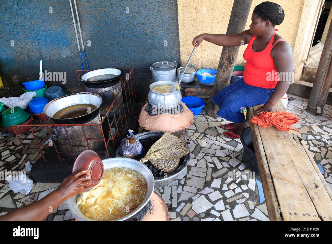 African kitchen. Cassava cooking in oil. Lome. Togo Stock Photo Alamy