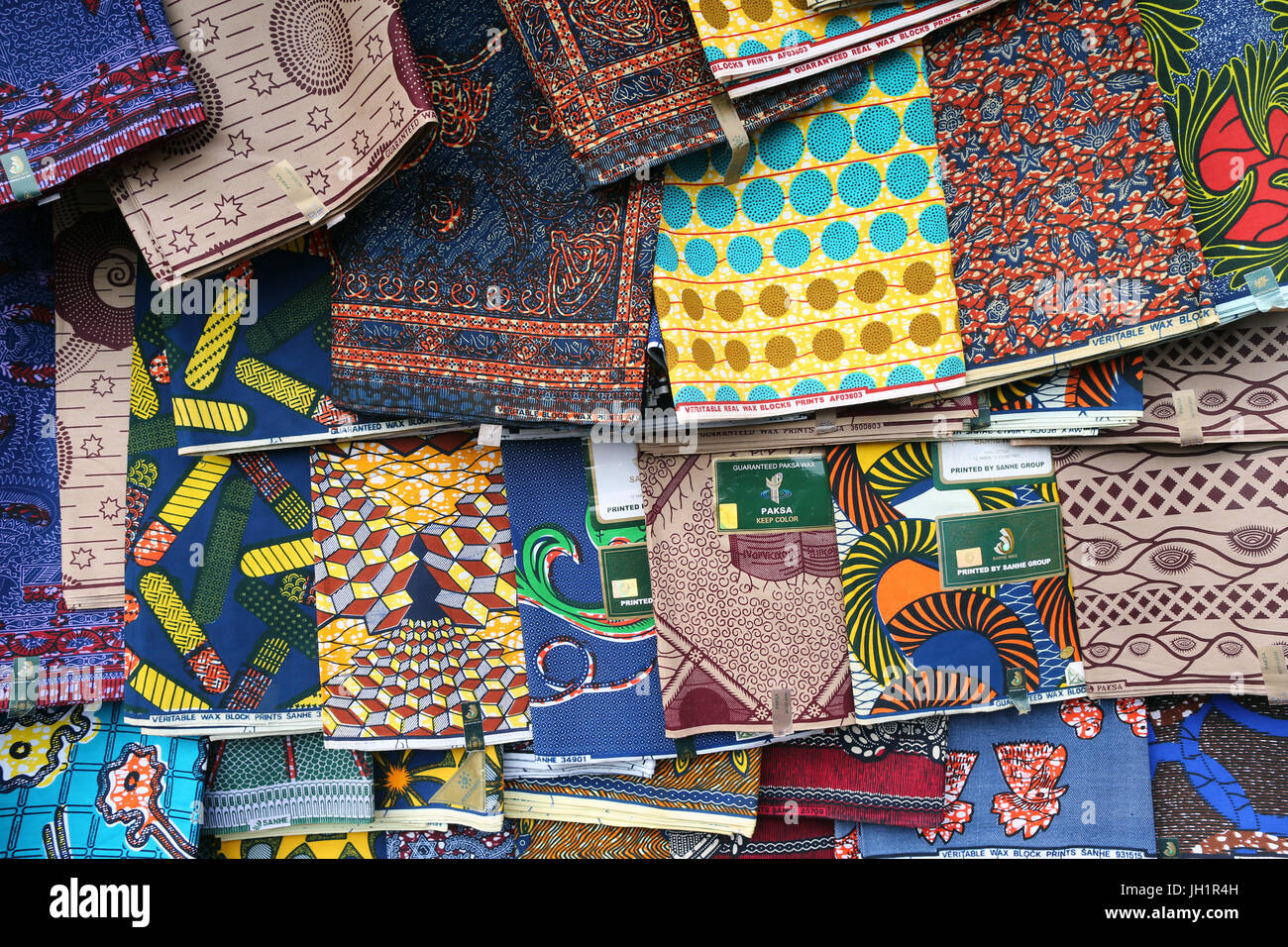 African market. Hanging wax print cloths. Togo. Stock Photo