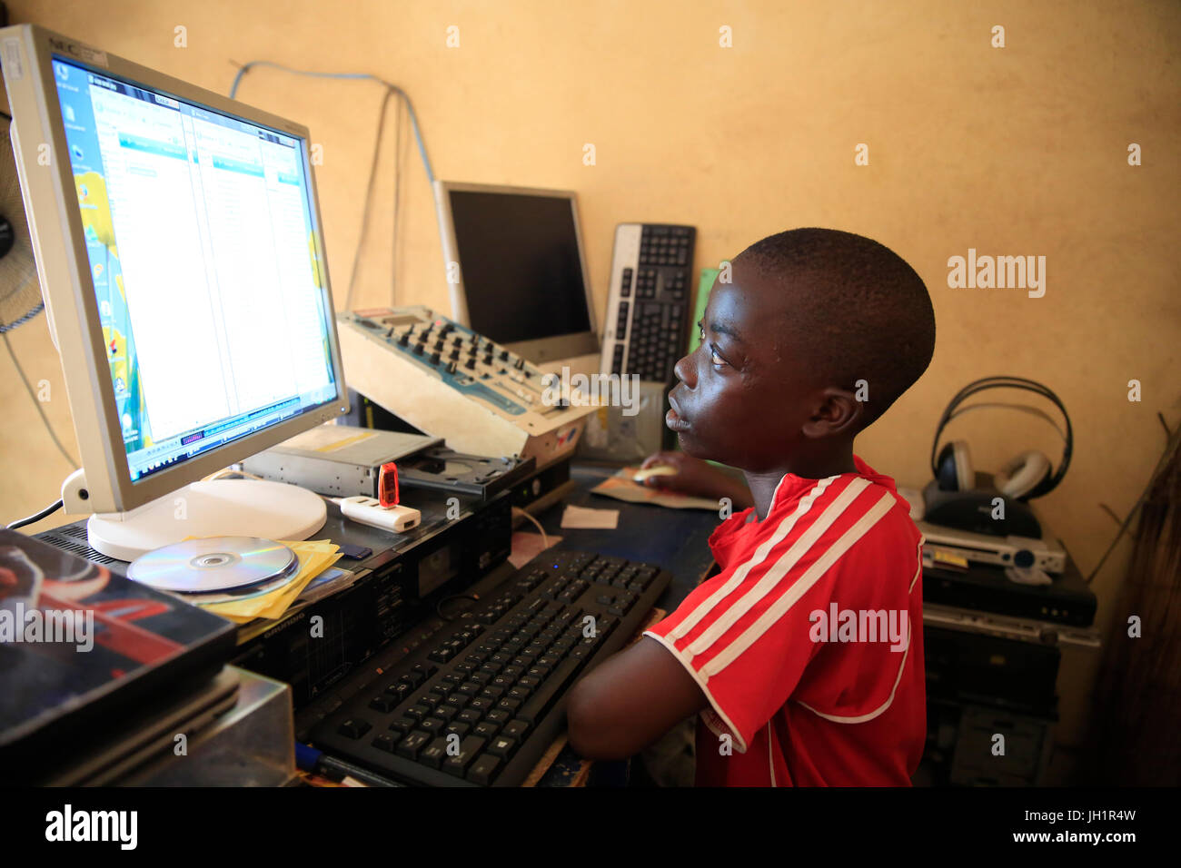 Young african boy using a computer.  Lome. Togo. Stock Photo
